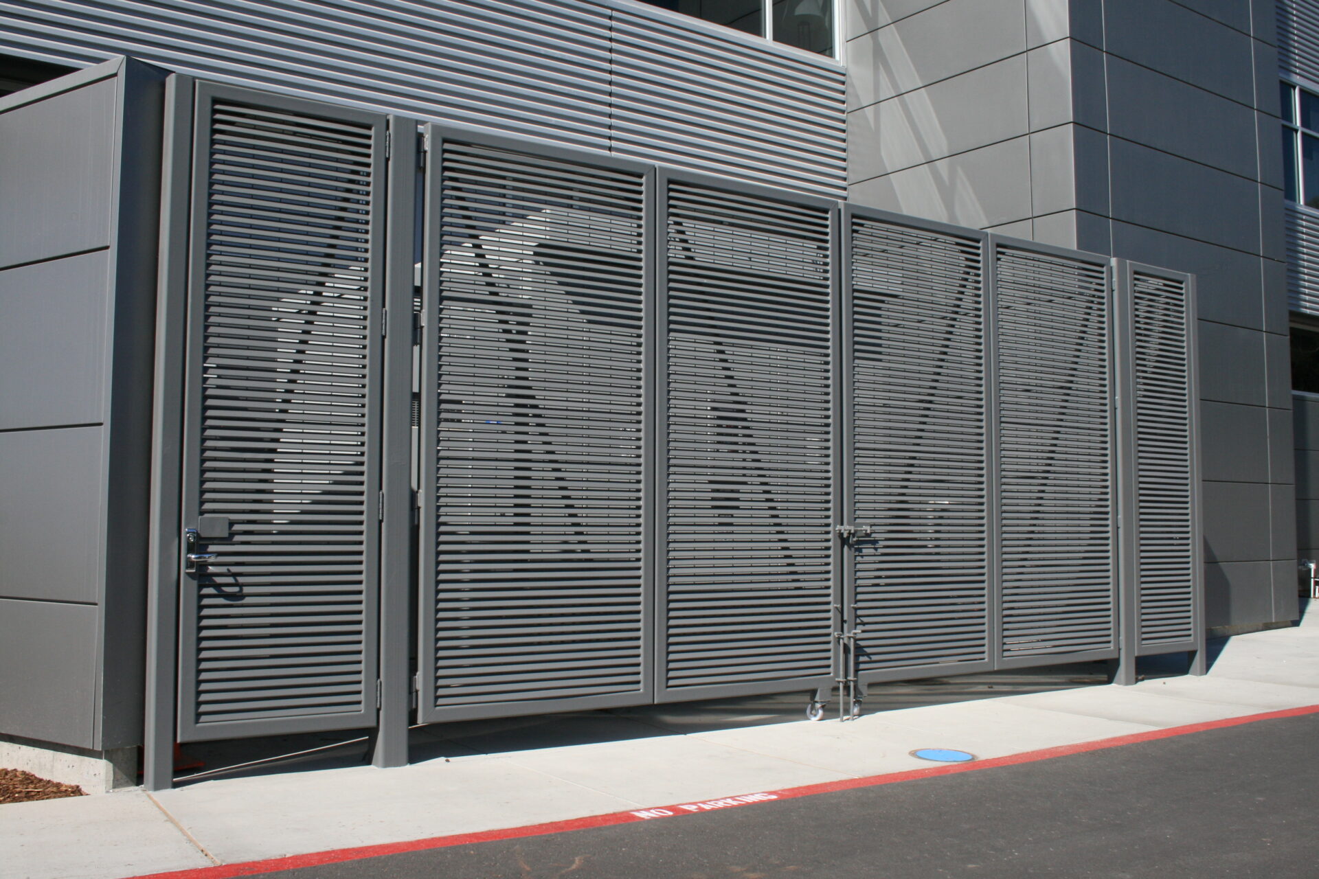 Opus80 louver grates provide screening enclosure with pedestrian grate